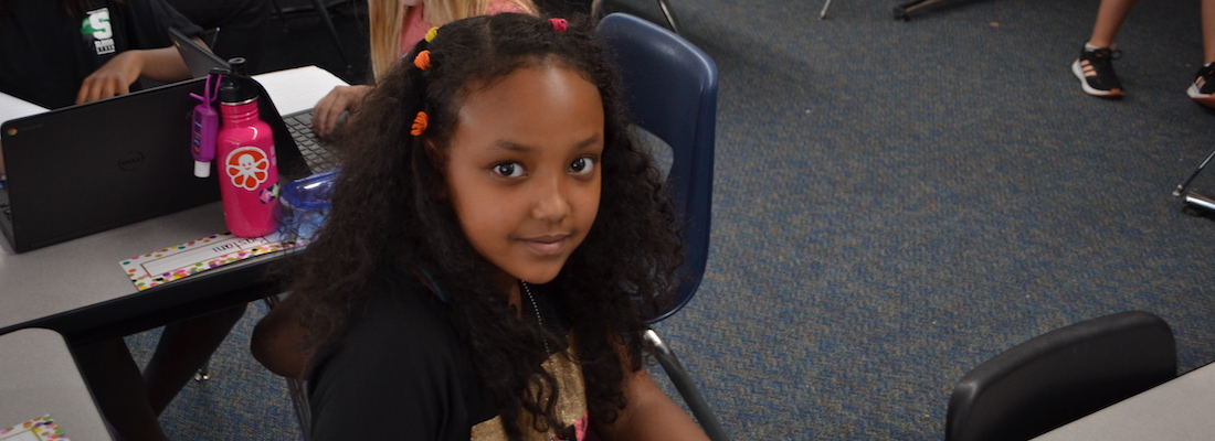 Student posing in class